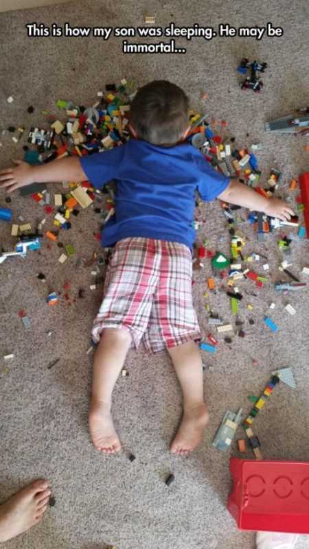 kid laying on legos