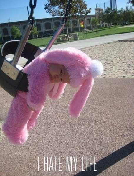 little-kid-in-a-bunny-costume-on-a-swing