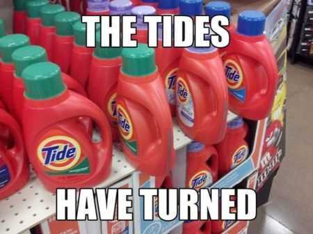 an image of supermarket aisle with several tide detergent bottles turned 90 degrees from others captioned the tides have turned.