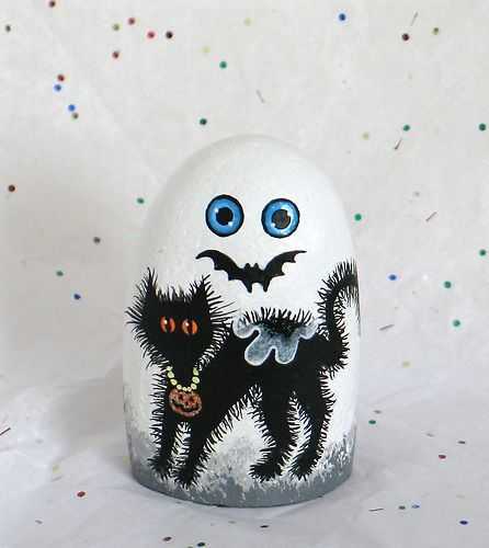 halloween painted rocks  ghost with a scared black cat