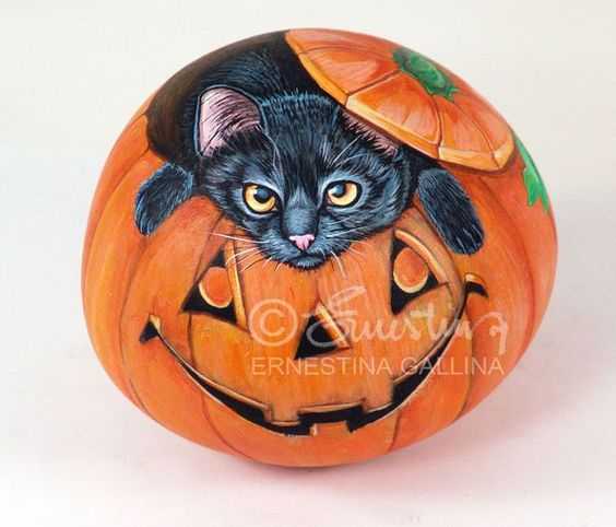 halloween painted rocks  black cat in jackolantern