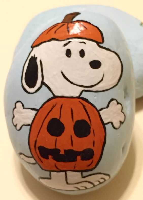 halloween painted rocks  snoopy in jackolantern costume