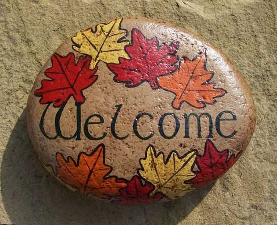 fall painted rock  welcome rock decorated with red yellow and orange maple leaves