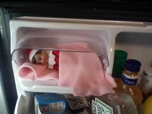elf on a shelf kitchen  sleeping in the butter compartment