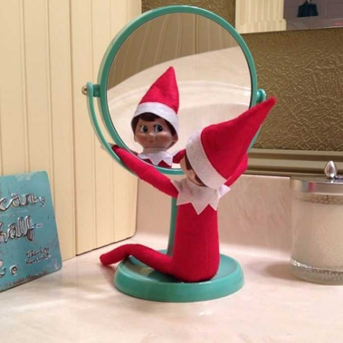 clever elf on the shelf ideas  staring in the mirror