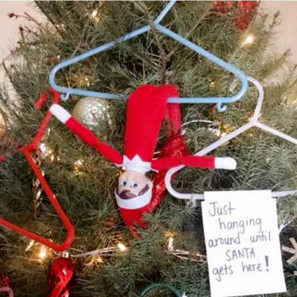 clever elf on the shelf ideas  hangers on the Christmas tree