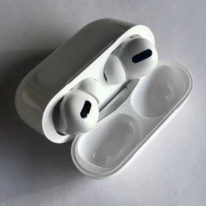 apple airpods pro in case on white table