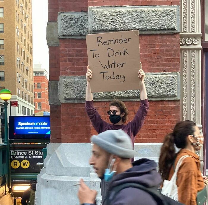30 Hilarious Pictures Of A Man Protesting Obscure Things 