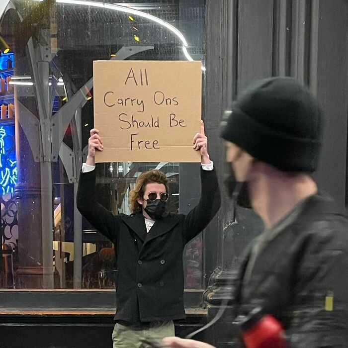 30 Hilarious Pictures Of A Man Protesting Obscure Things 