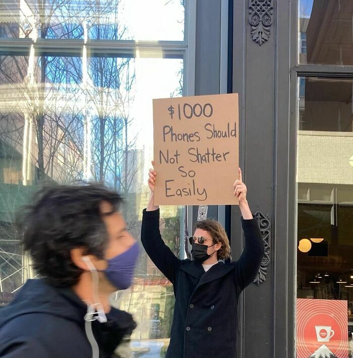 30 Hilarious Pictures Of A Man Protesting Obscure Things 